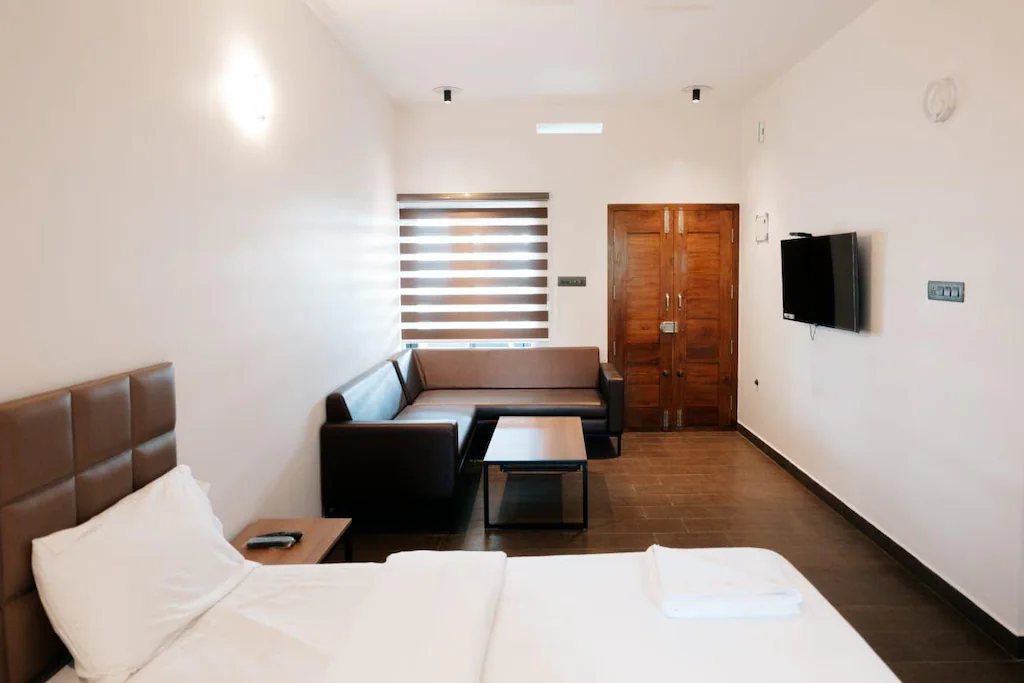 A room with a separate sitting area